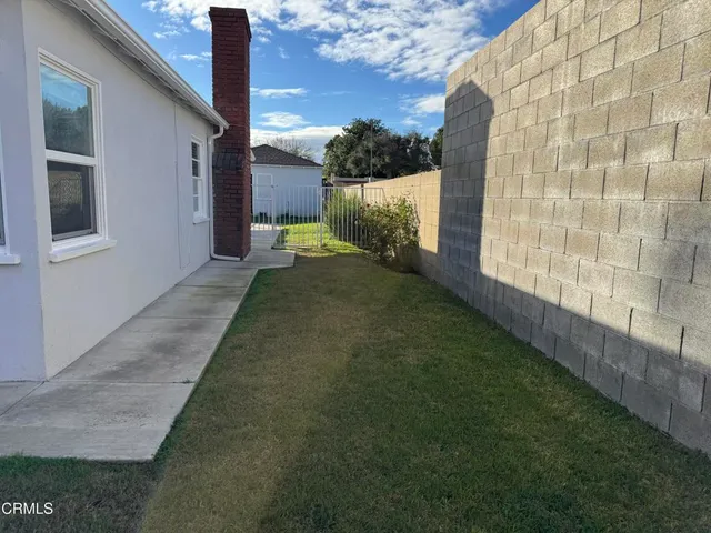 a view of a back yard of the house