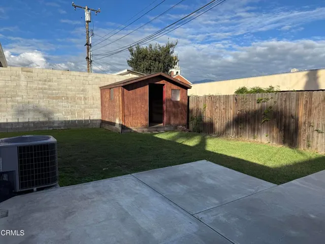 a front view of a house with a yard and a garage