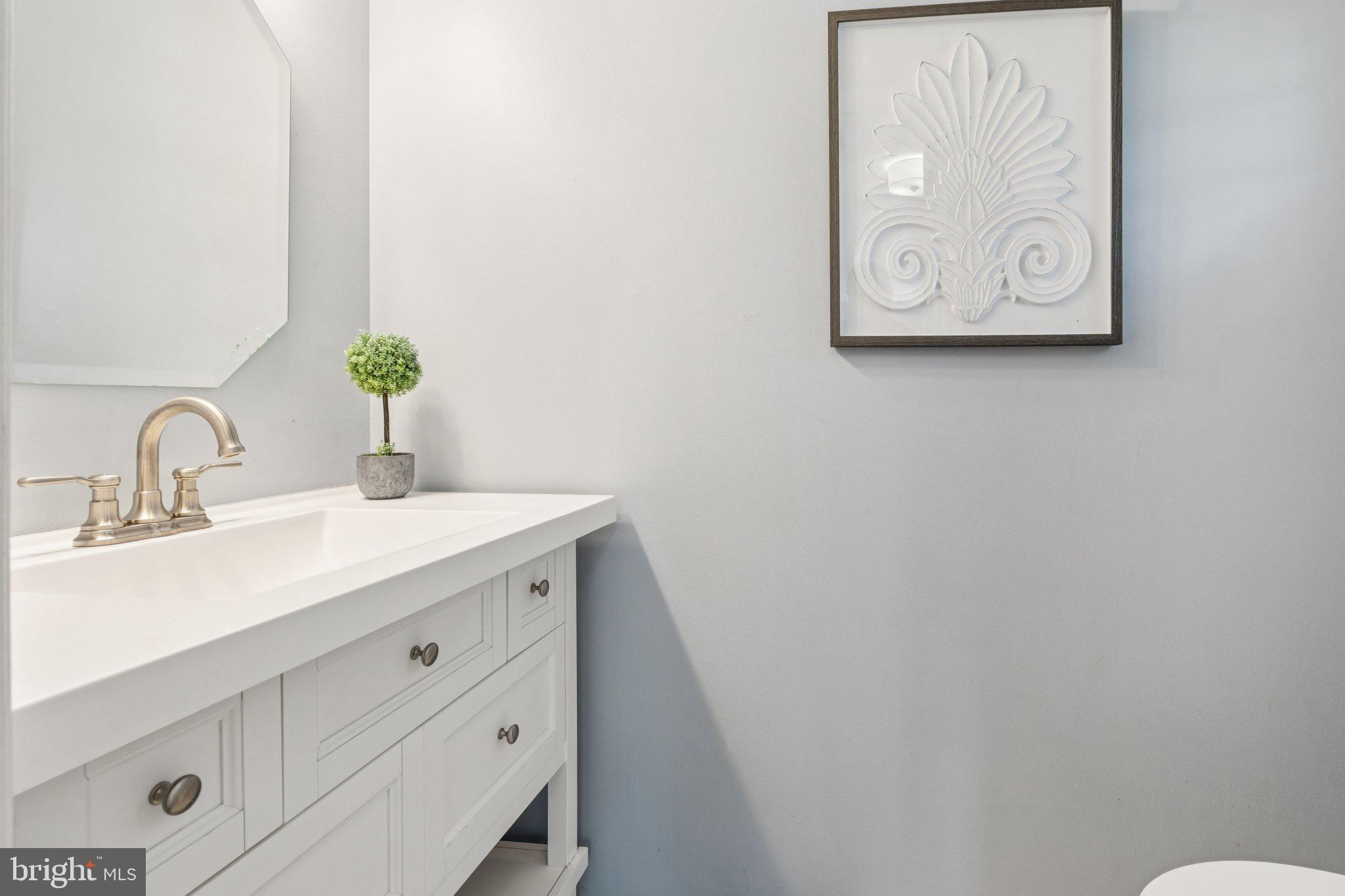 2050 Horace Ward Road Owings, MD 20736 - Photo 11 of 39 a bathroom with a sink and a mirror