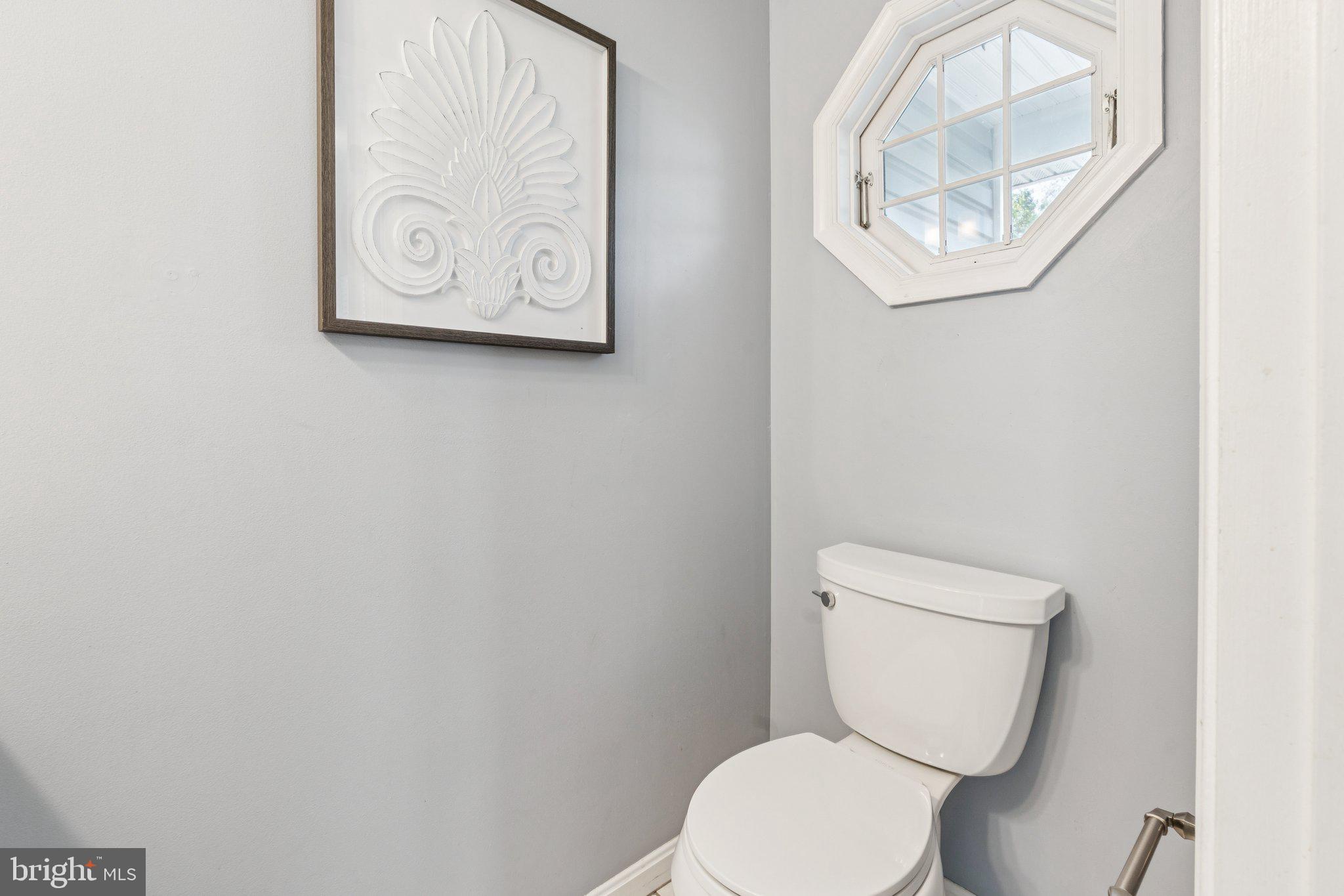 2050 Horace Ward Road Owings, MD 20736 - Photo 12 of 39 a white toilet sitting next to a white wall