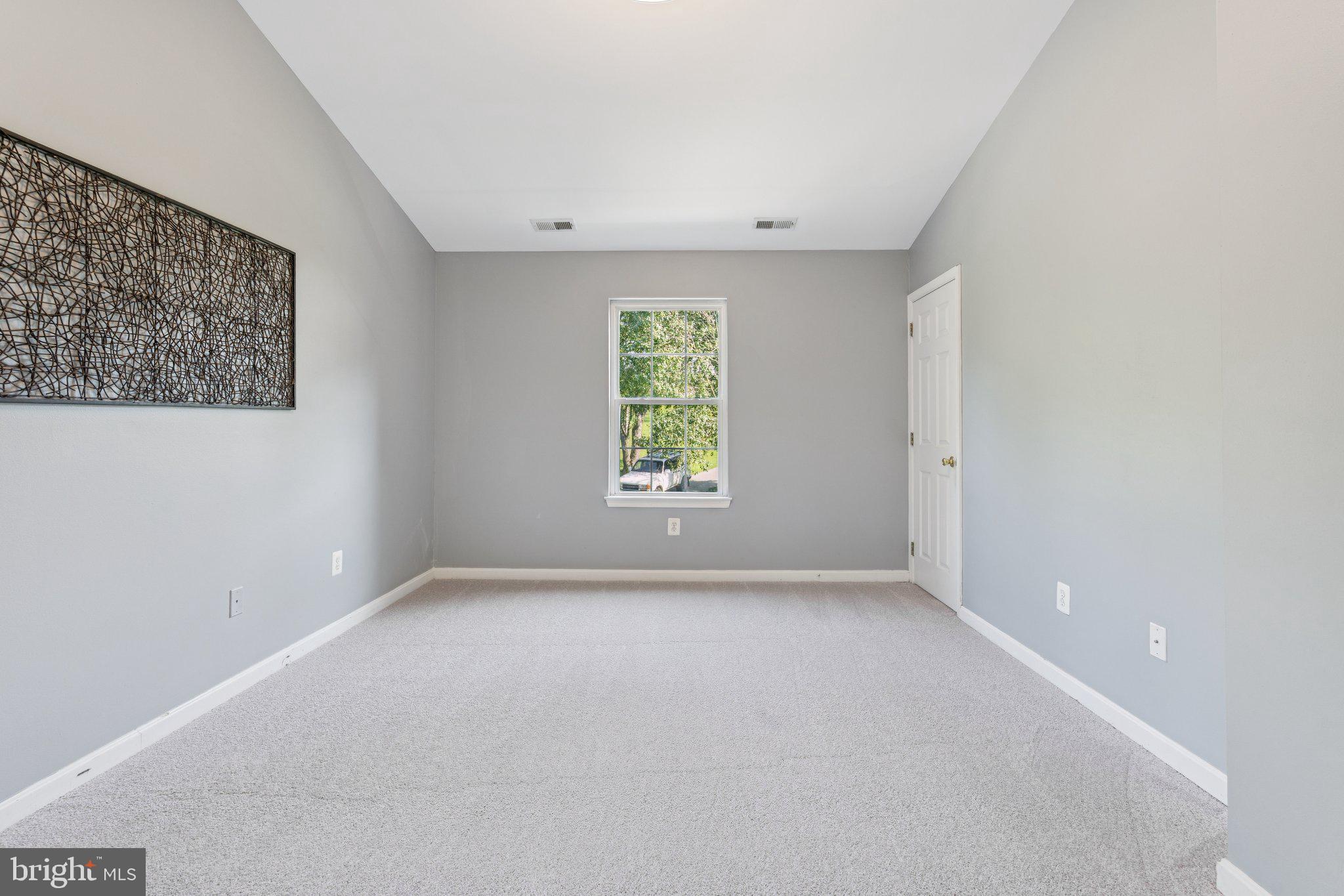 2050 Horace Ward Road Owings, MD 20736 - Photo 14 of 39 an empty room with windows