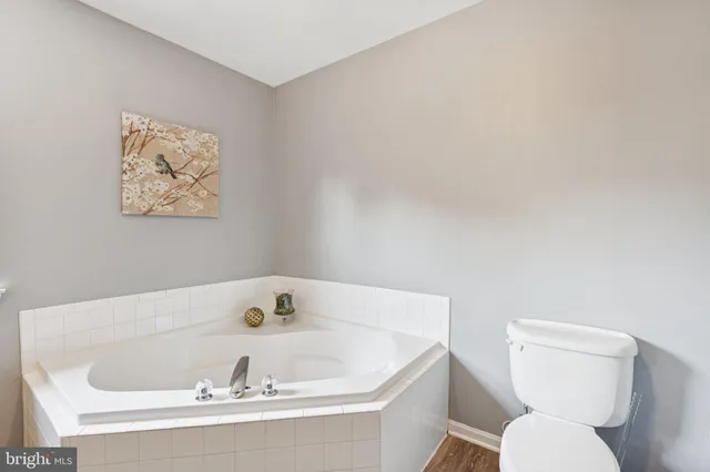 a bathroom with a toilet and a sink