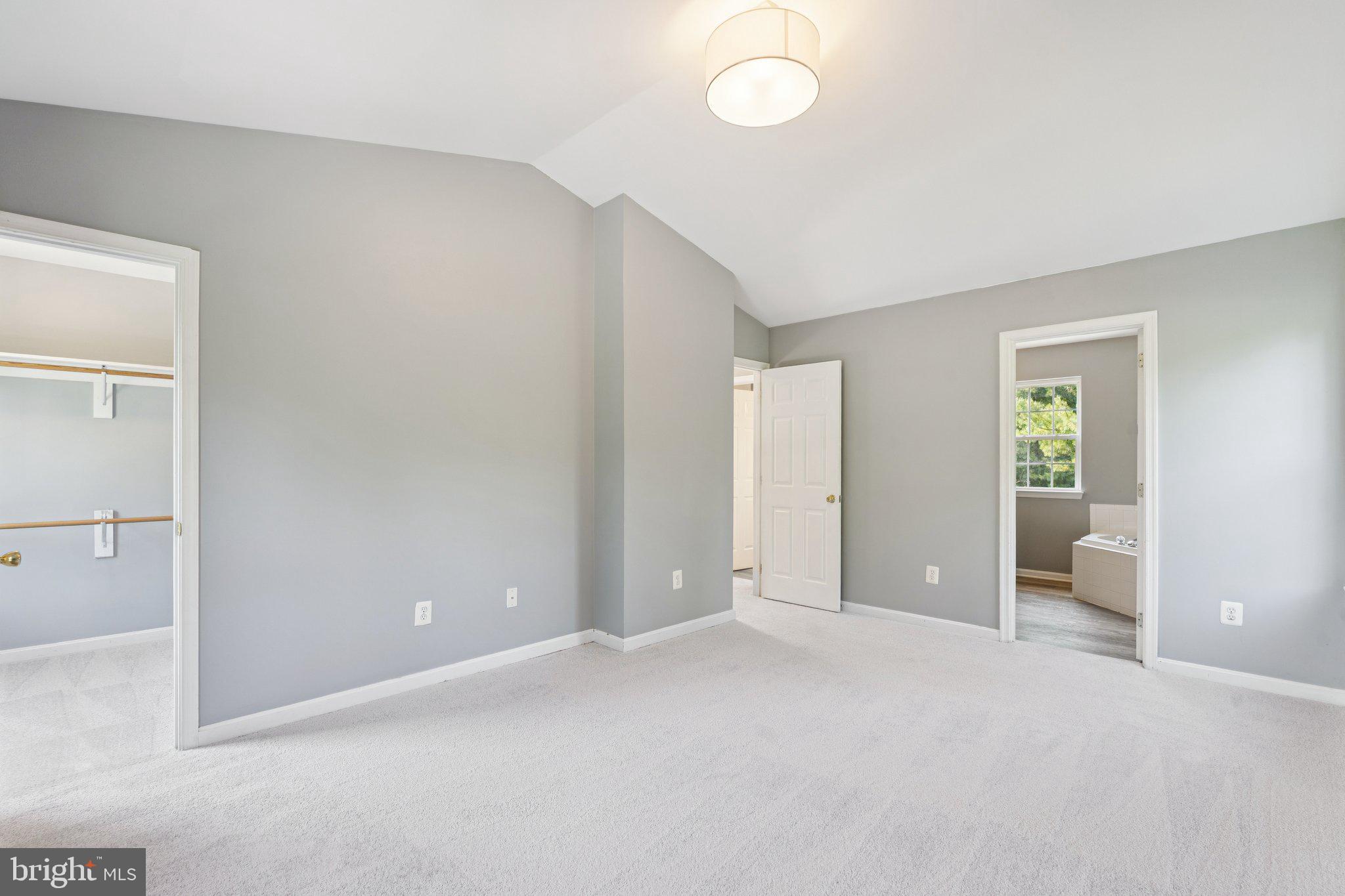 2050 Horace Ward Road Owings, MD 20736 - Photo 19 of 39 wooden floor in an empty room and a bathroom