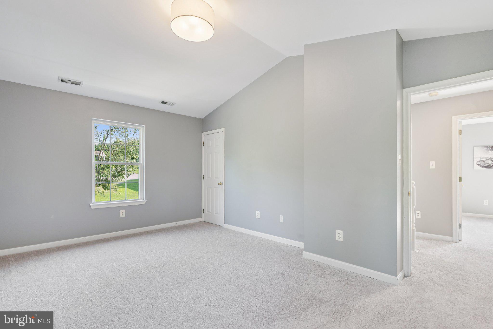 2050 Horace Ward Road Owings, MD 20736 - Photo 20 of 39 a view of an empty room with a window