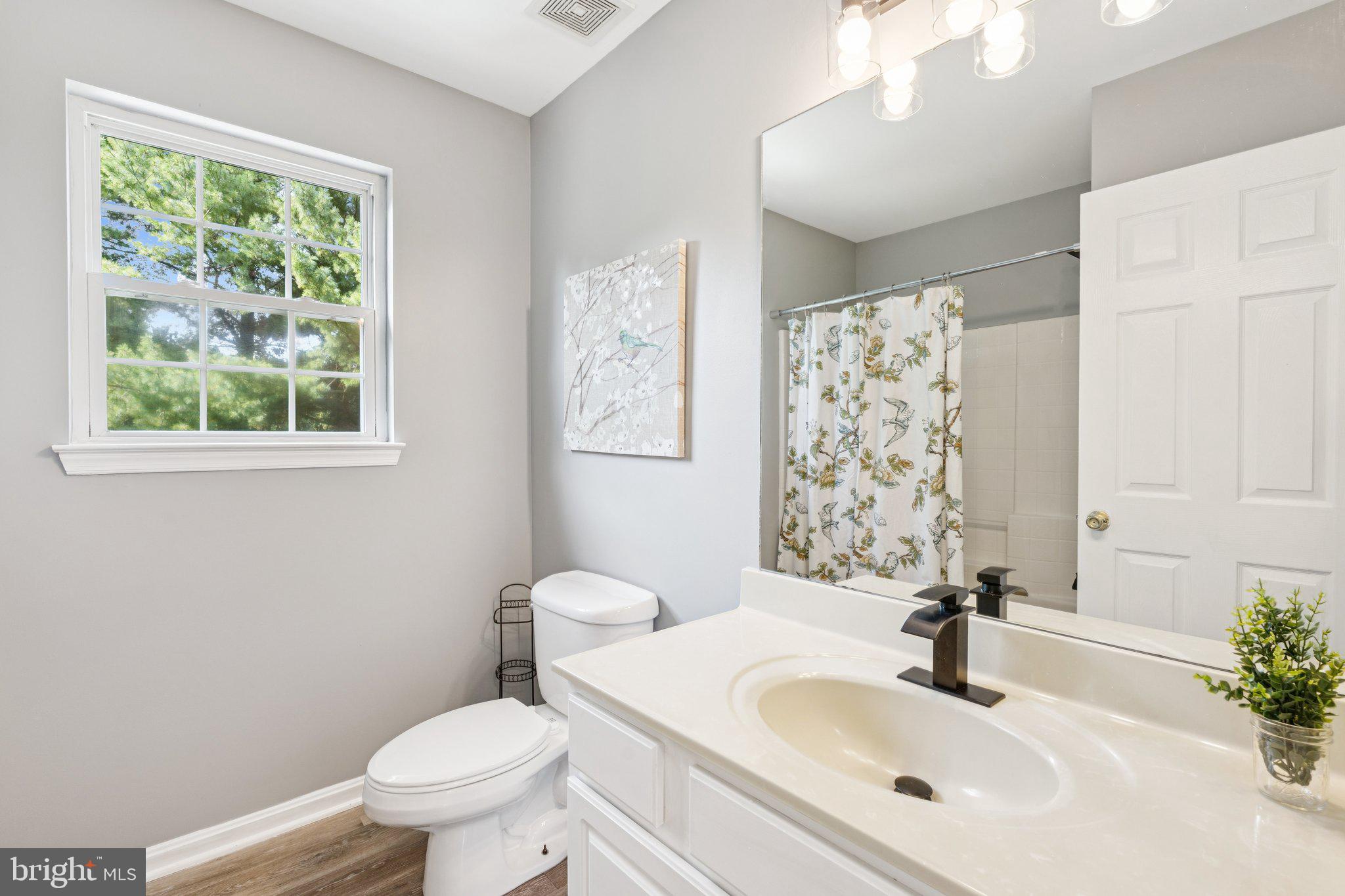 2050 Horace Ward Road Owings, MD 20736 - Photo 21 of 39 a bathroom with a sink toilet and shower