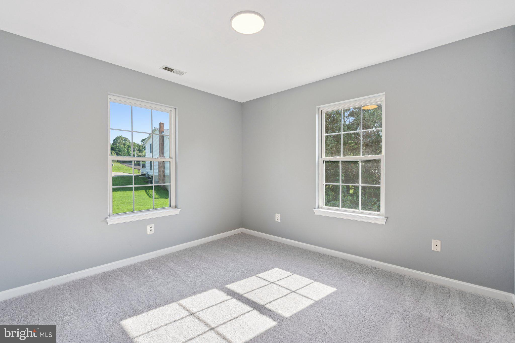 2050 Horace Ward Road Owings, MD 20736 - Photo 22 of 39 an empty room with windows