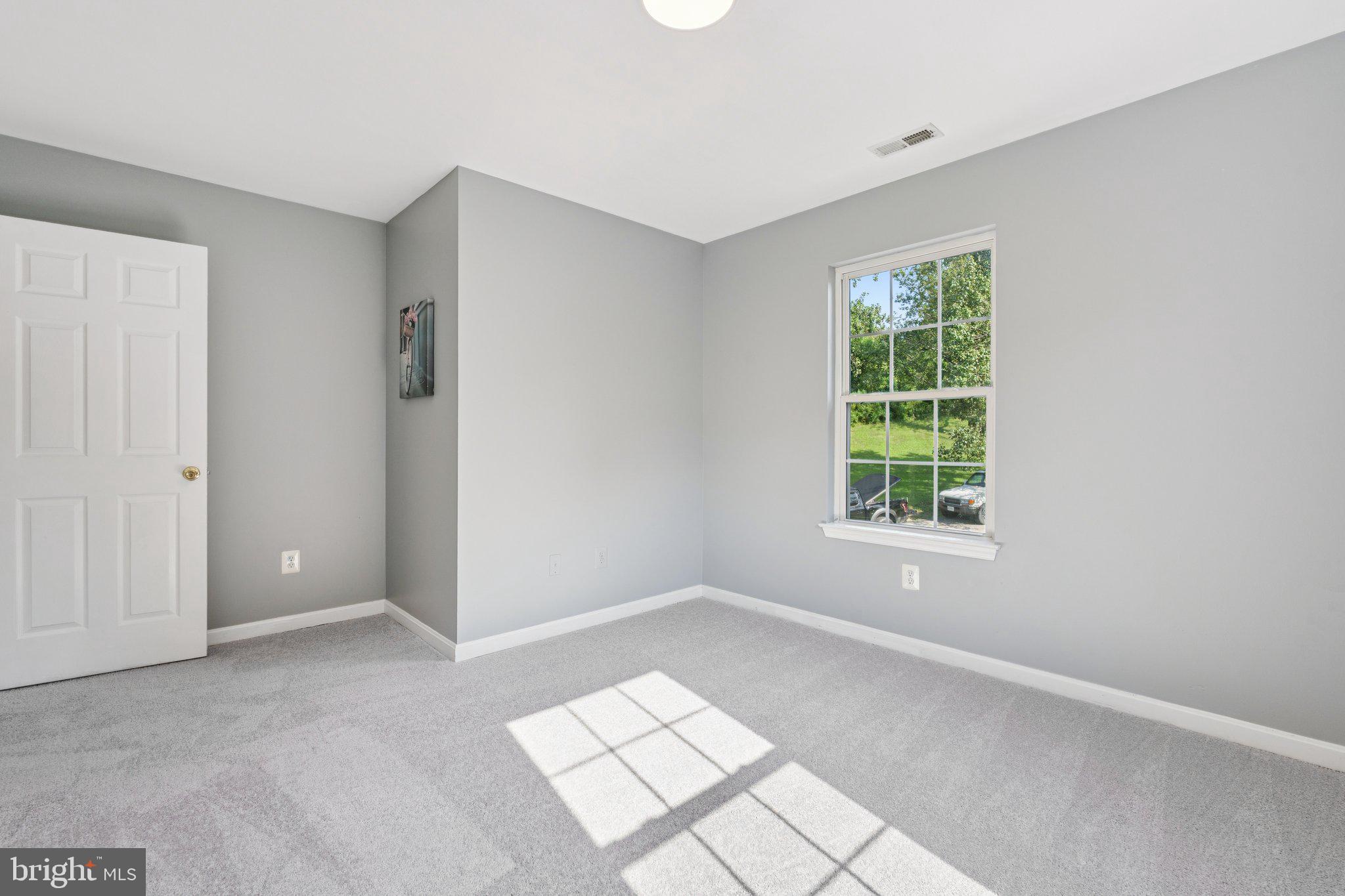 2050 Horace Ward Road Owings, MD 20736 - Photo 23 of 39 an empty room with windows and closet