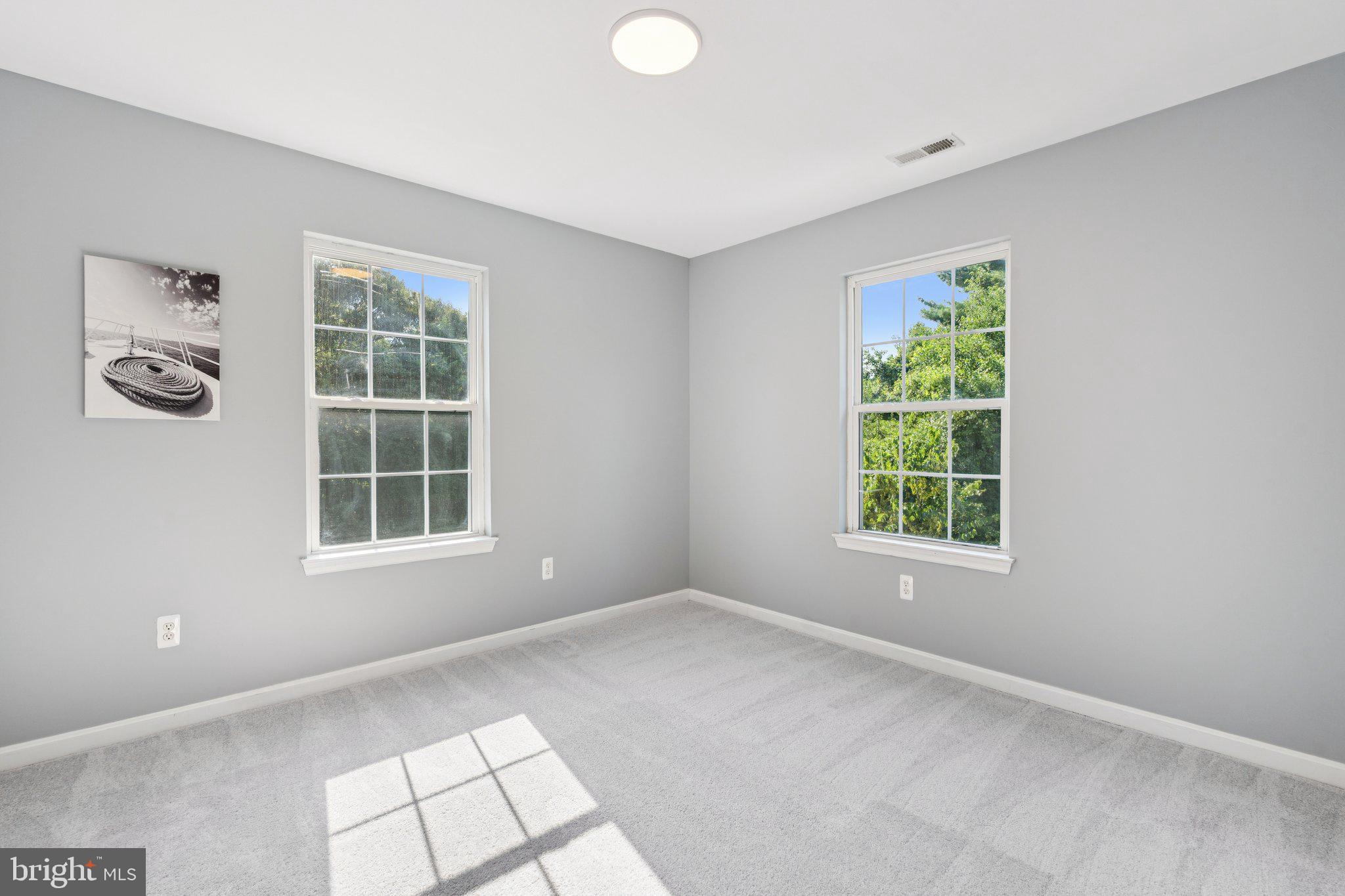 2050 Horace Ward Road Owings, MD 20736 - Photo 29 of 39 an empty room with windows and closet