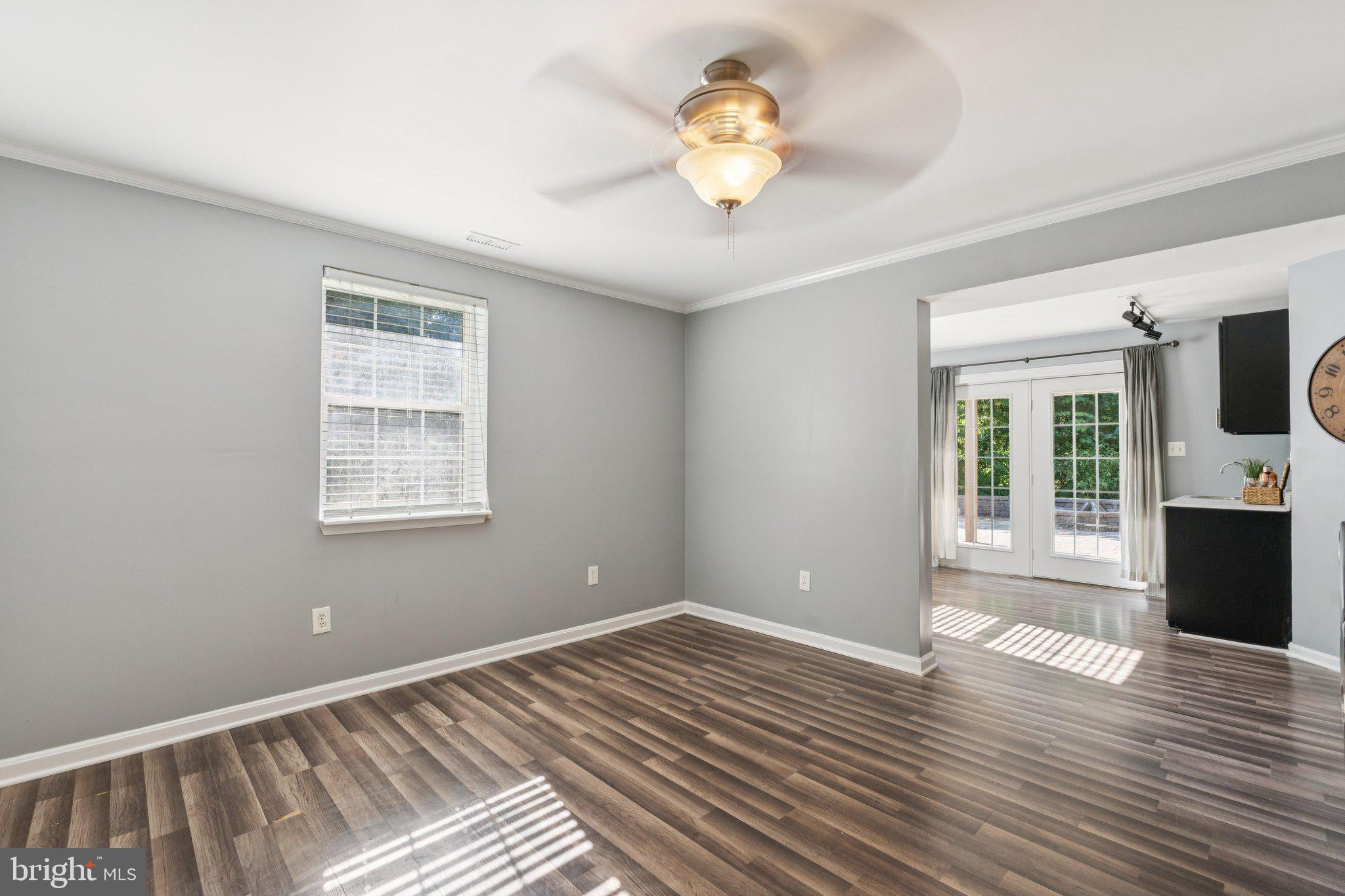 2050 Horace Ward Road Owings, MD 20736 - Photo 30 of 39 a view of an empty room with a window and wooden floor