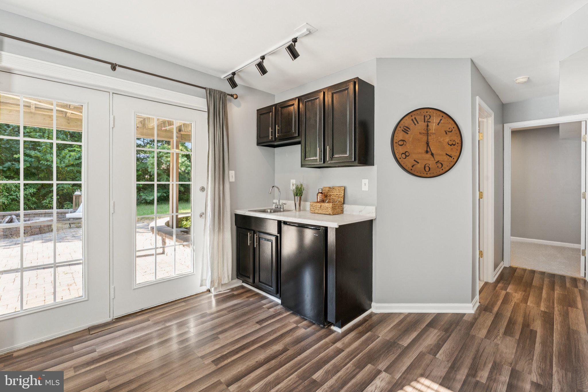 2050 Horace Ward Road Owings, MD 20736 - Photo 31 of 39 a view of a kitchen with fridge and wooden floor