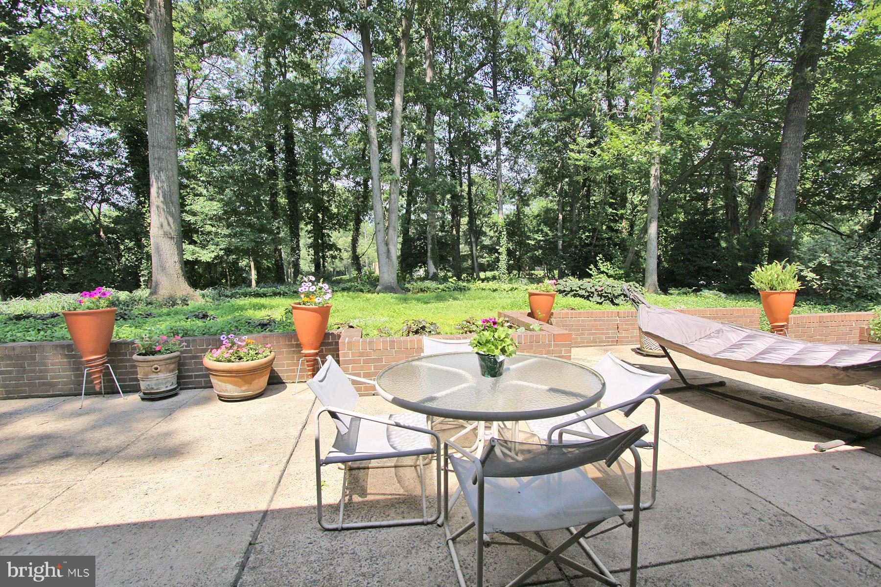 11433 Hook Road Reston, VA 20190 - Photo 14 of 29 a backyard of a house with a table and chairs