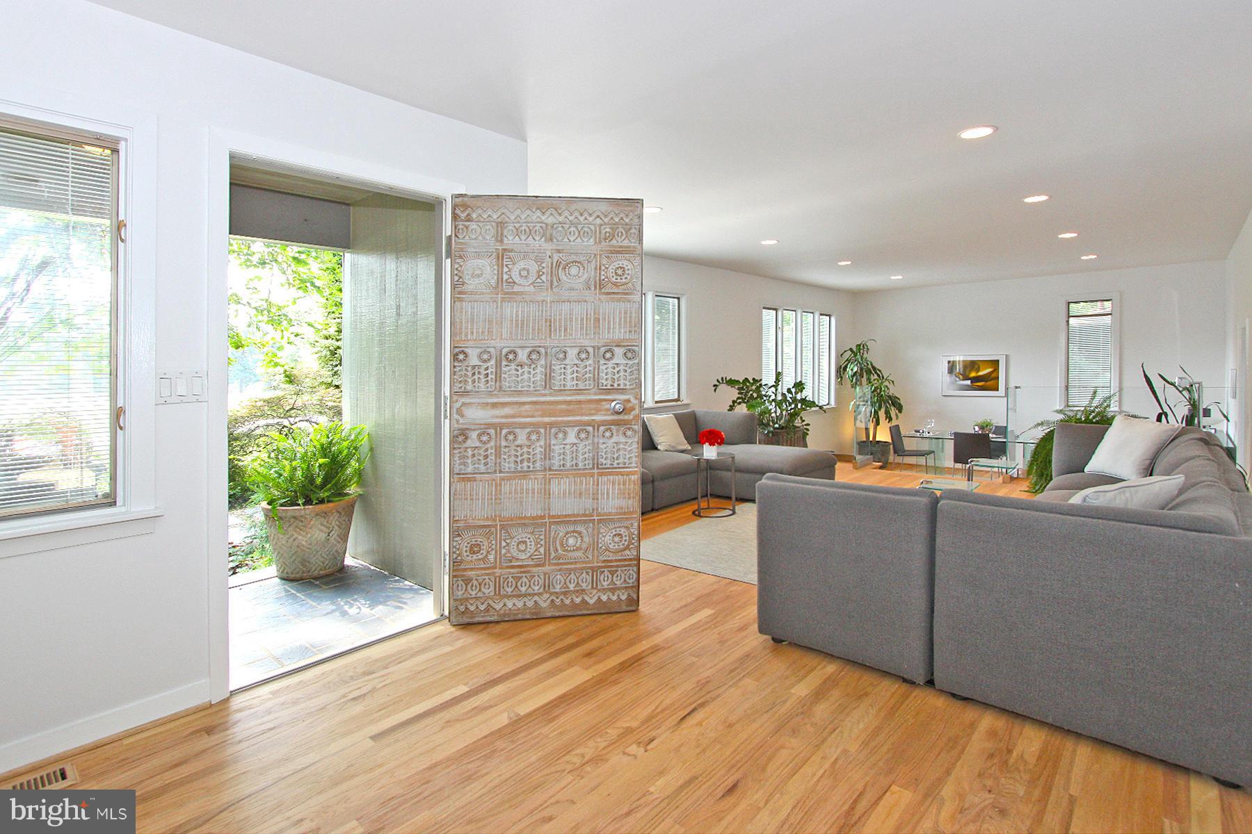 11433 Hook Road Reston, VA 20190 - Photo 3 of 29 a living room with furniture and a potted plant