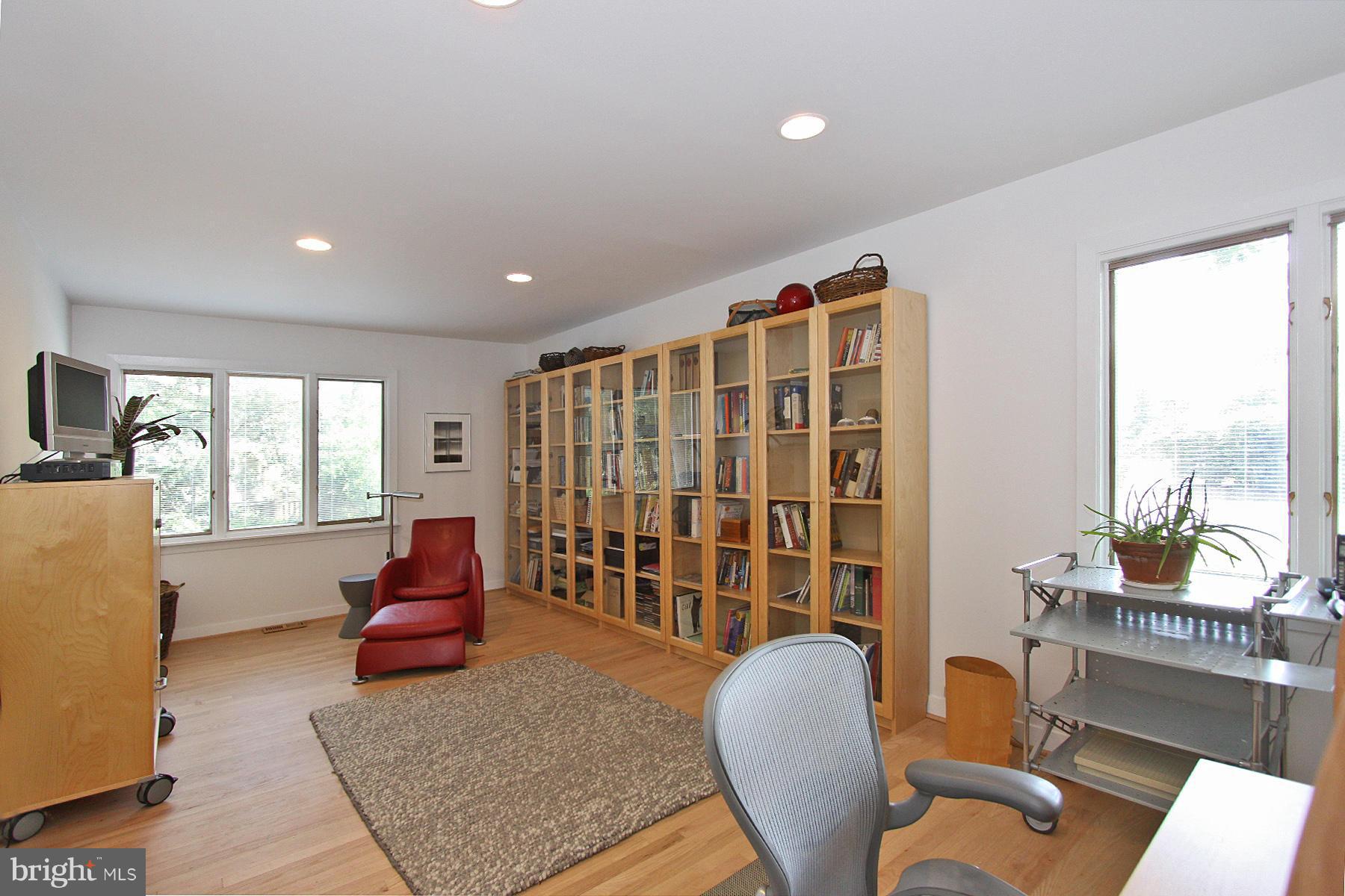 11433 Hook Road Reston, VA 20190 - Photo 23 of 29 a living room with furniture and a floor to ceiling window
