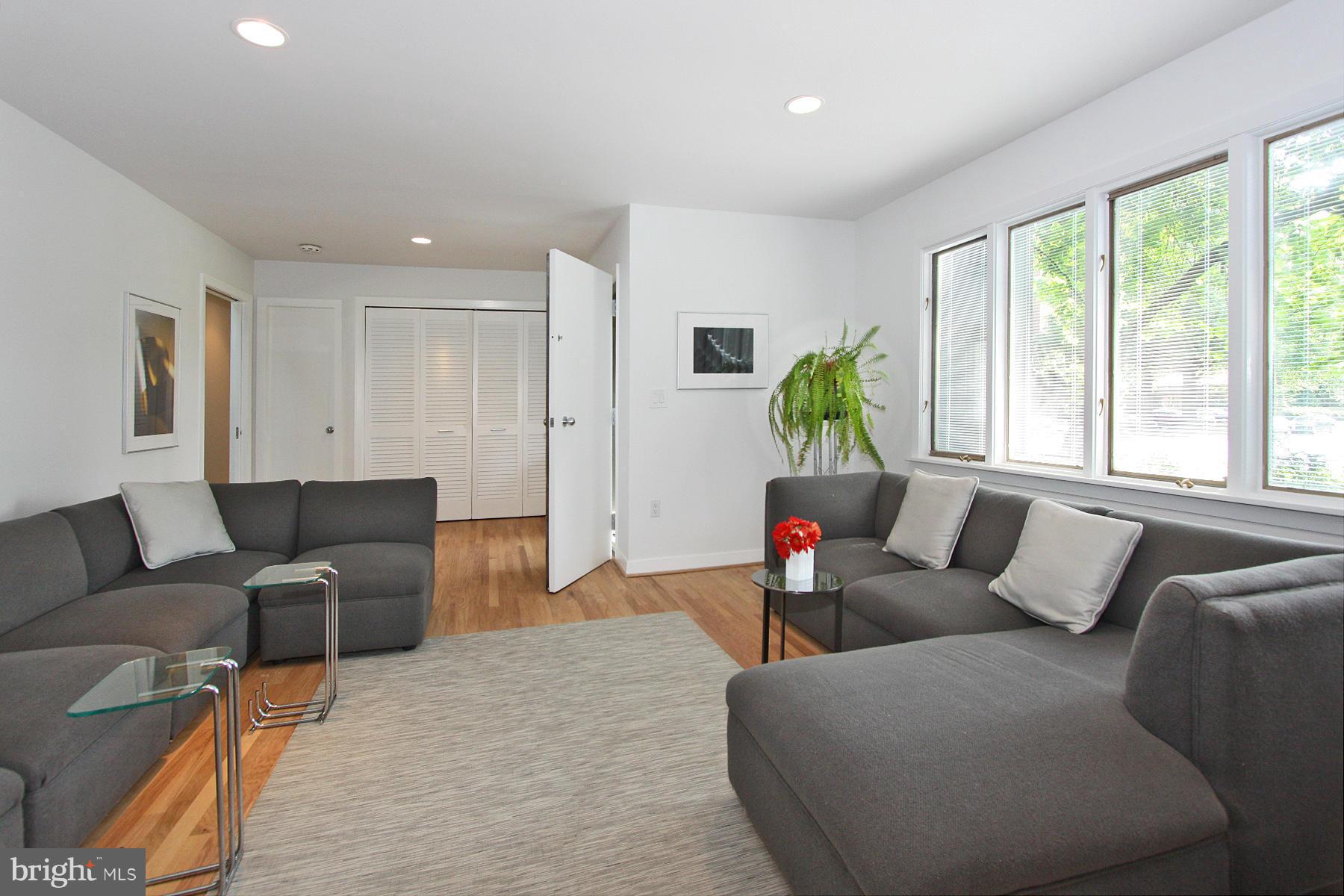 11433 Hook Road Reston, VA 20190 - Photo 5 of 29 a living room with furniture and a large window