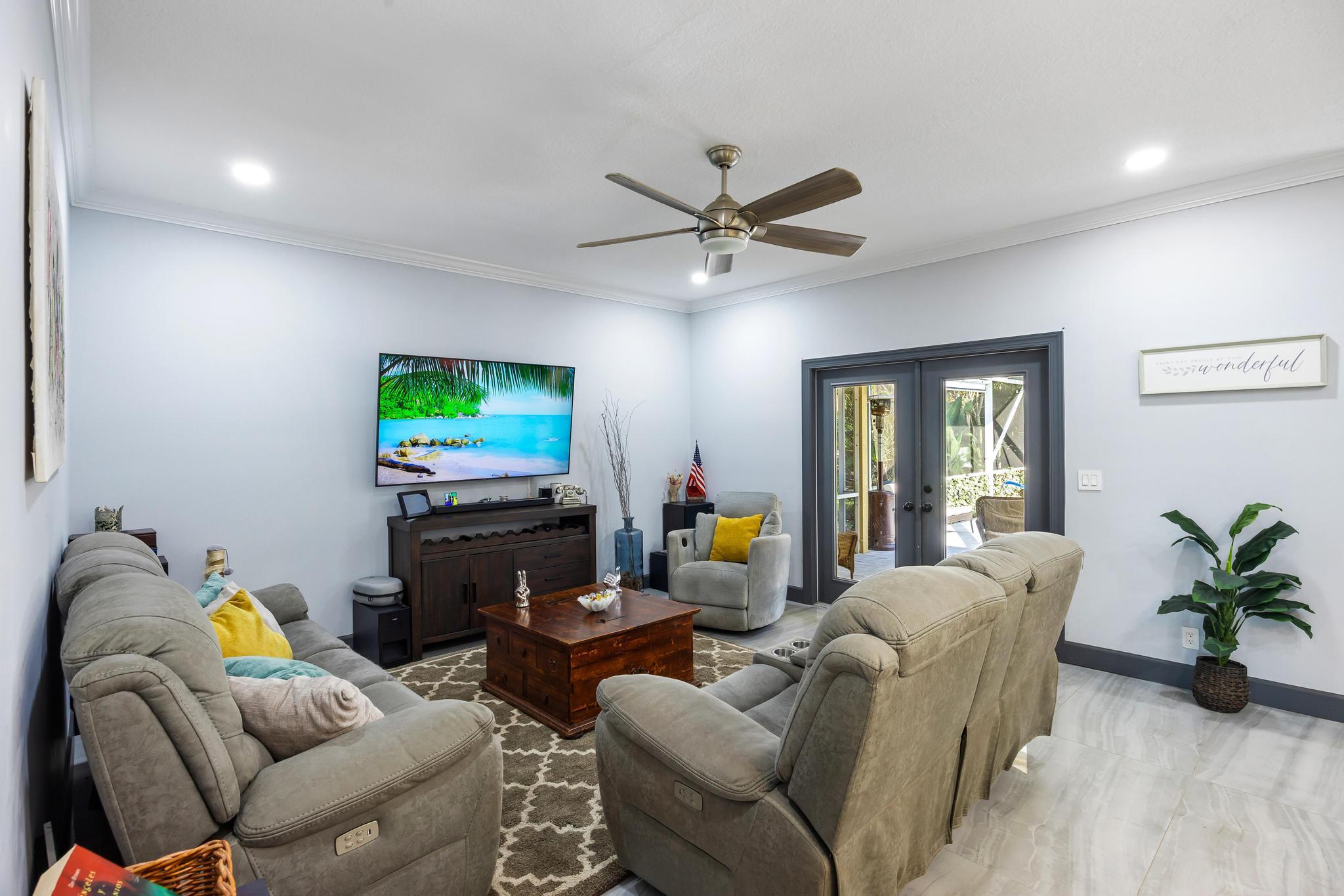 3337 Southwest Crestview Road Port St. Lucie, FL 34953 - Photo 13 of 86 a living room with furniture and a flat screen tv