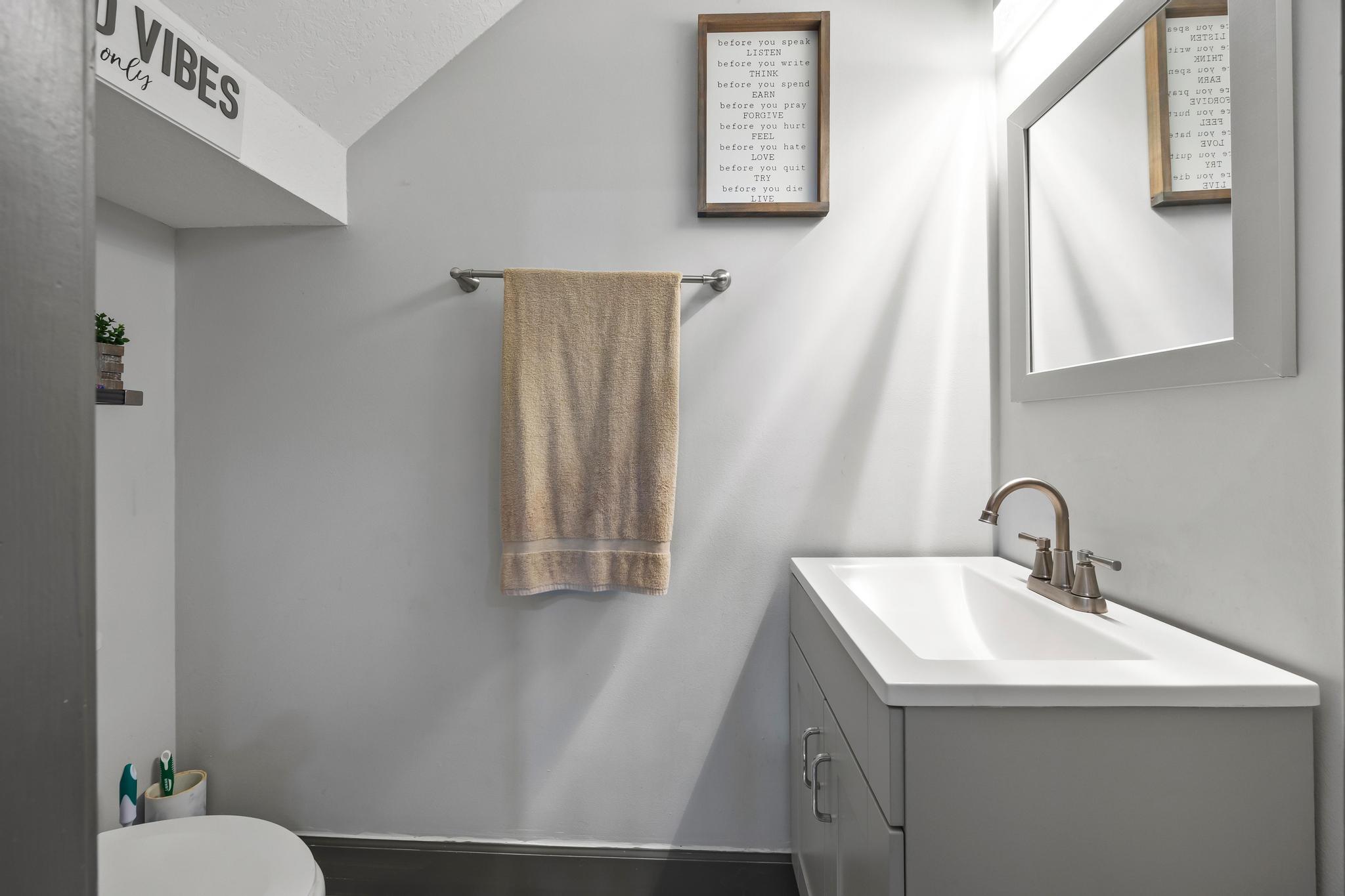 3337 Southwest Crestview Road Port St. Lucie, FL 34953 - Photo 20 of 86 a bathroom with a sink and a mirror