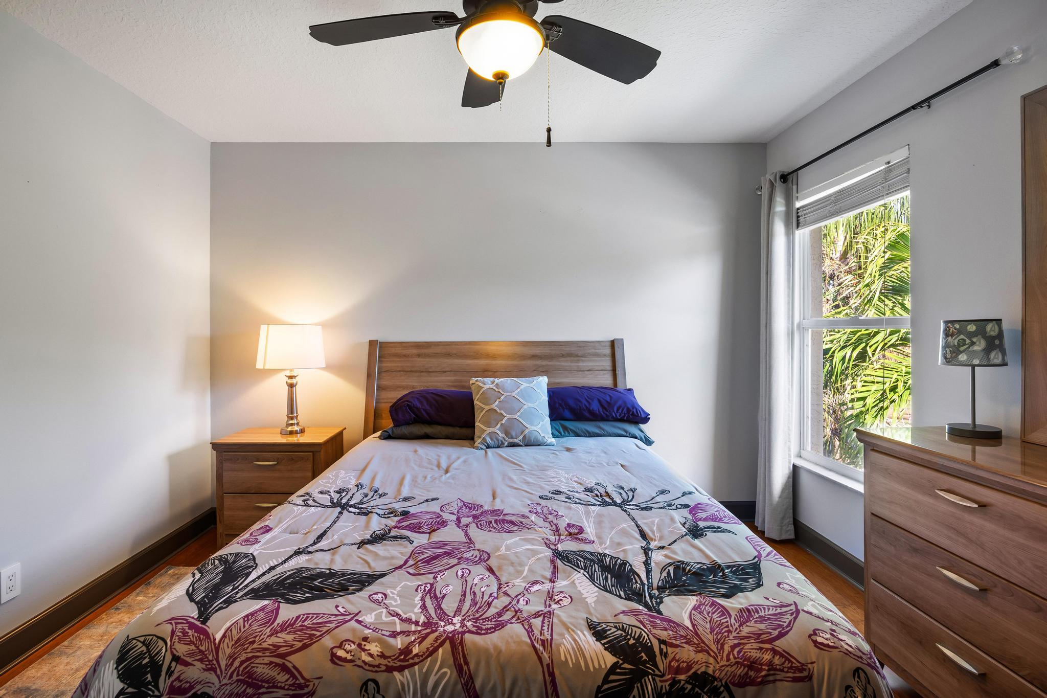 3337 Southwest Crestview Road Port St. Lucie, FL 34953 - Photo 30 of 86 a bedroom with a large bed and a large window