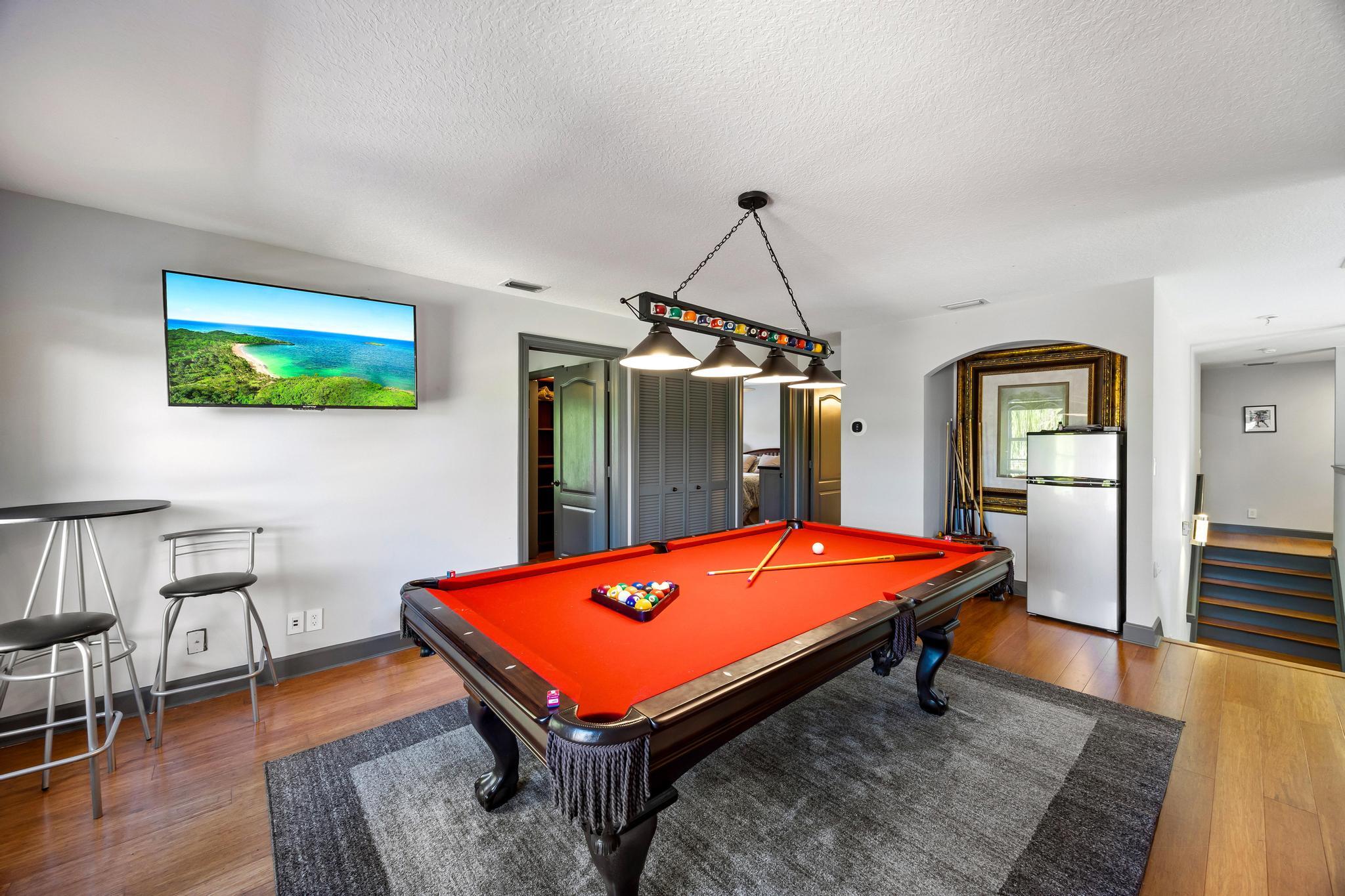 3337 Southwest Crestview Road Port St. Lucie, FL 34953 - Photo 36 of 86 a room with pool table and wooden floor