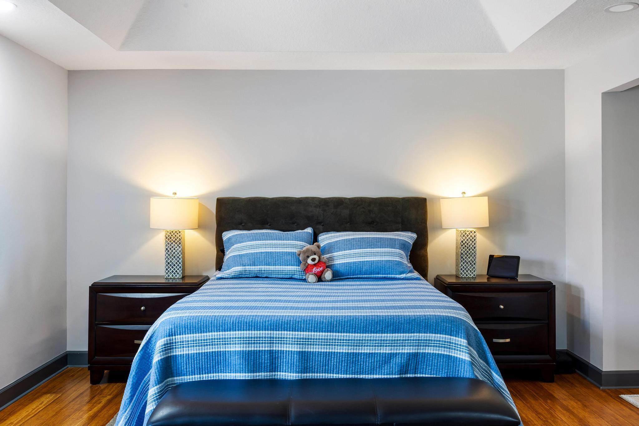 3337 Southwest Crestview Road Port St. Lucie, FL 34953 - Photo 38 of 86 a bedroom with a bed and a night stand