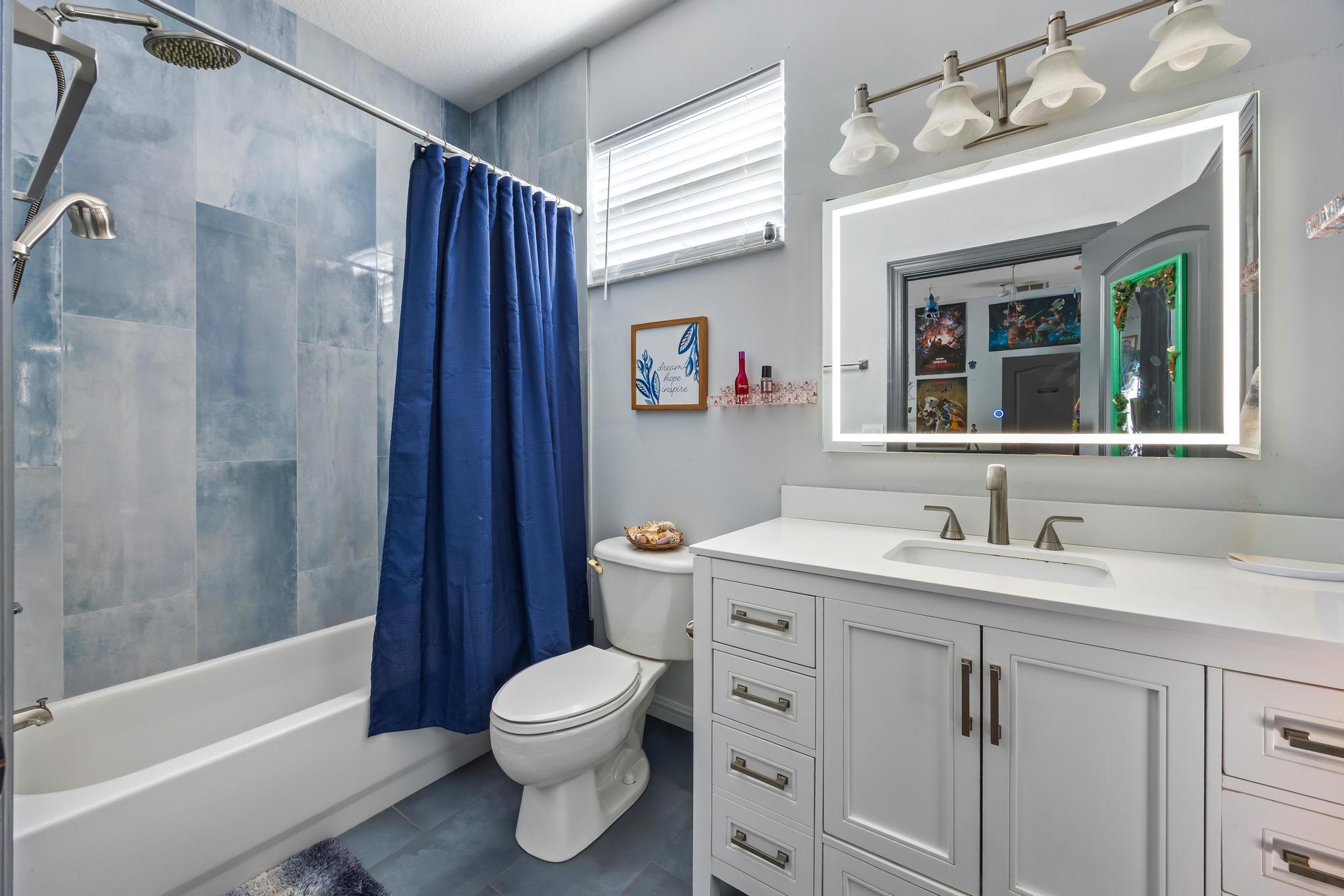 3337 Southwest Crestview Road Port St. Lucie, FL 34953 - Photo 47 of 86 a bathroom with a sink toilet and shower