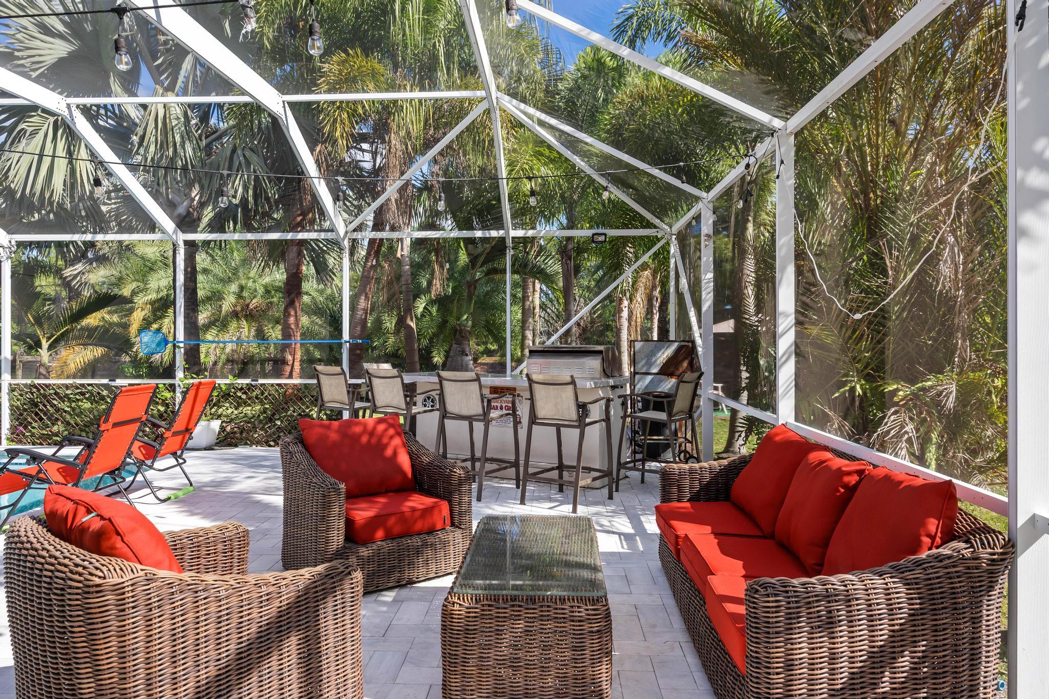 3337 Southwest Crestview Road Port St. Lucie, FL 34953 - Photo 58 of 86 a outdoor living space with furniture and garden view