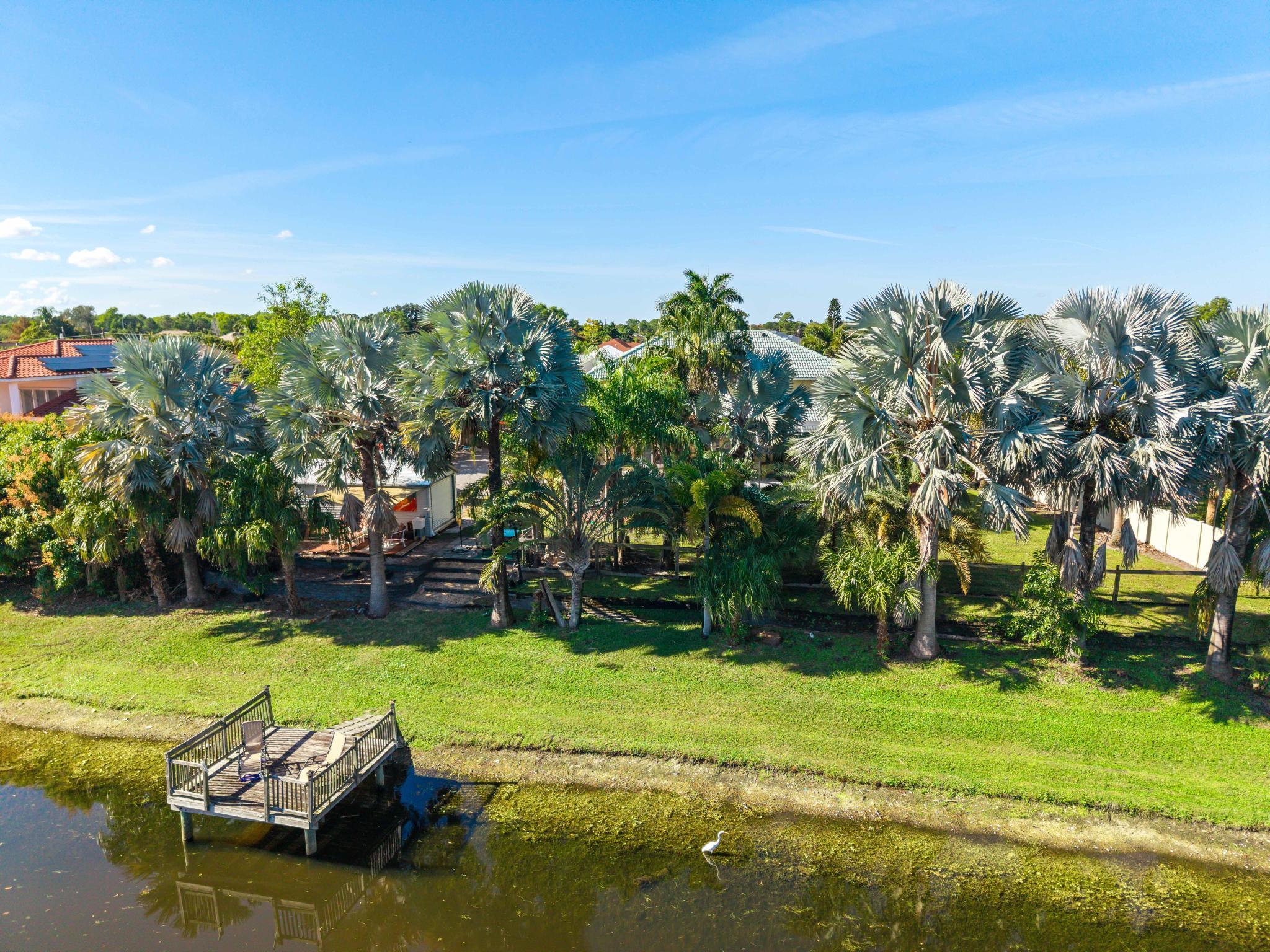 3337 Southwest Crestview Road Port St. Lucie, FL 34953 - Photo 72 of 86 a view of a golf course with a lake