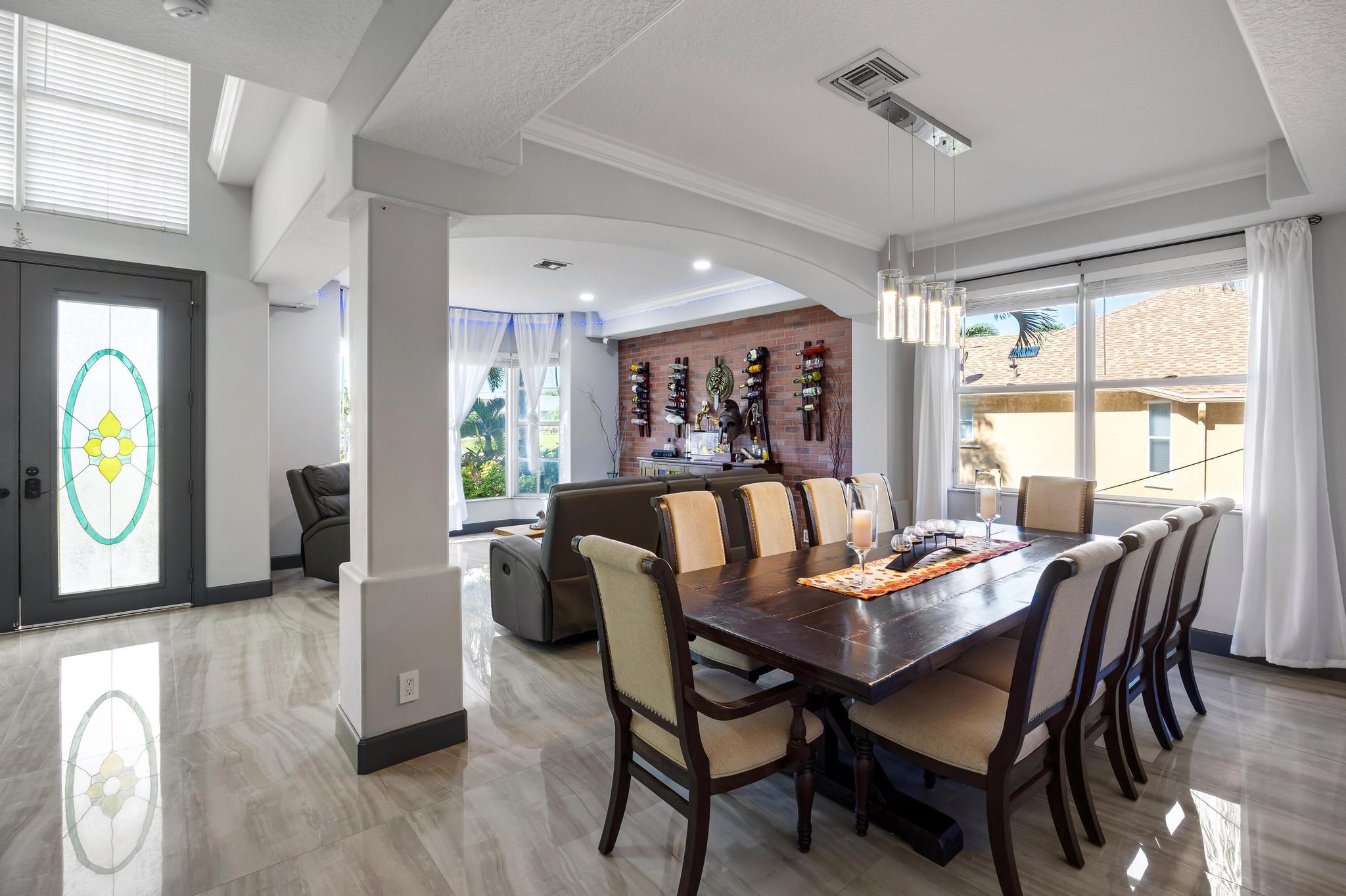 3337 Southwest Crestview Road Port St. Lucie, FL 34953 - Photo 10 of 86 a dining room with furniture and window