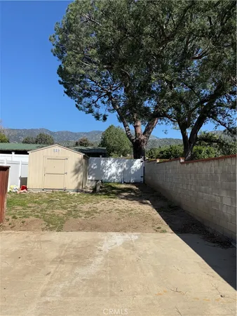 a view of a backyard of a house
