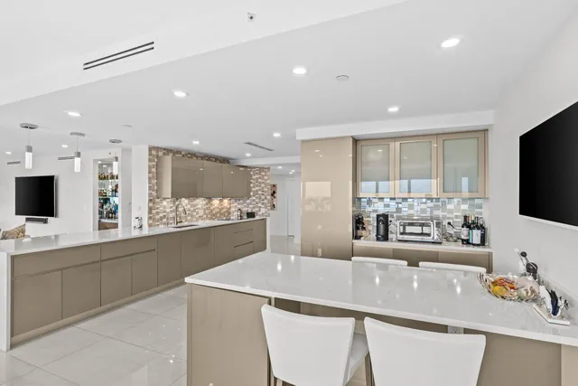 a kitchen with a sink stove and microwave