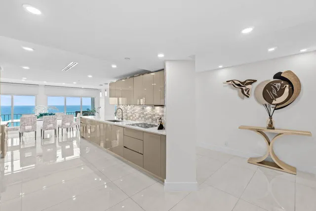 a kitchen with a table and chairs