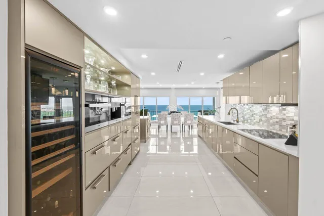 a large white kitchen with lots of counter top space