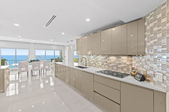 a kitchen with lots of counter top space and living room