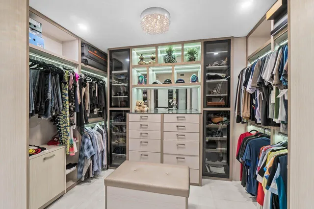 a view of kitchen with furniture and refrigerator