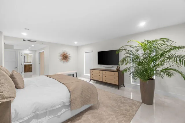 a spacious bathroom with a double vanity sink mirror and toilet