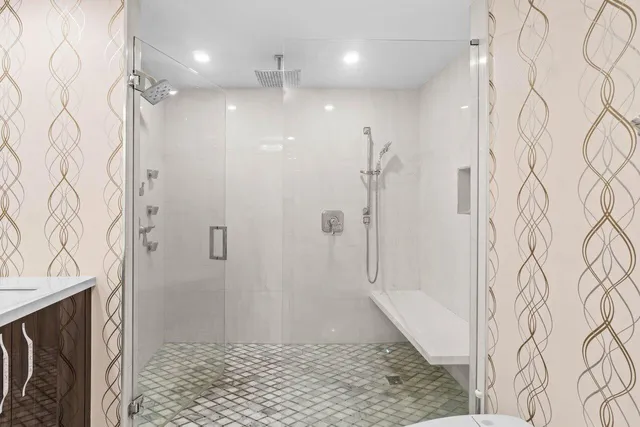 a bathroom with a sink toilet and shower