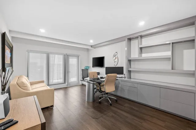 a bedroom with a bed and a potted plant