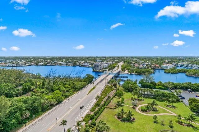 a balcony with couple of flower in front of it