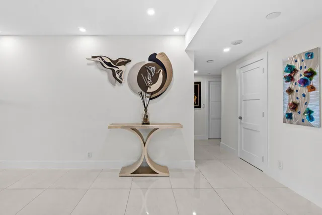 a view of a hallway with a chandelier