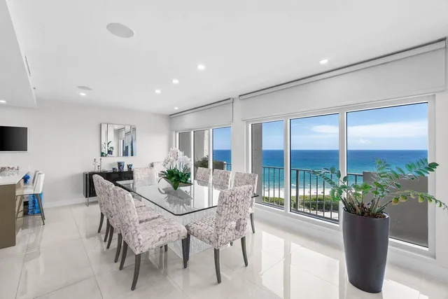 a view of a dining room with furniture window and garden view