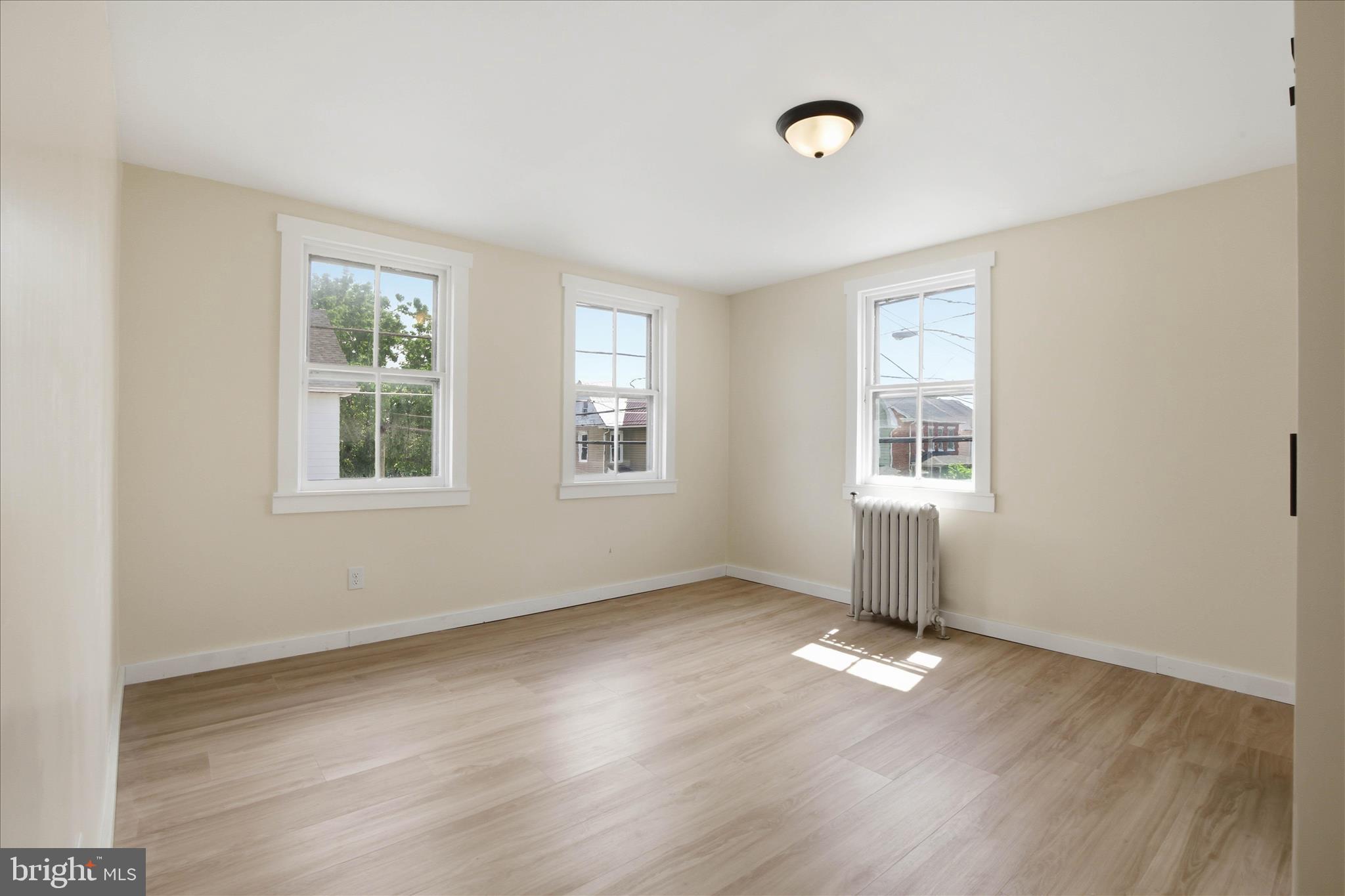 101 East Lincoln Avenue Lititz, PA 17543 - Photo 21 of 39 an empty room with wooden floor and windows
