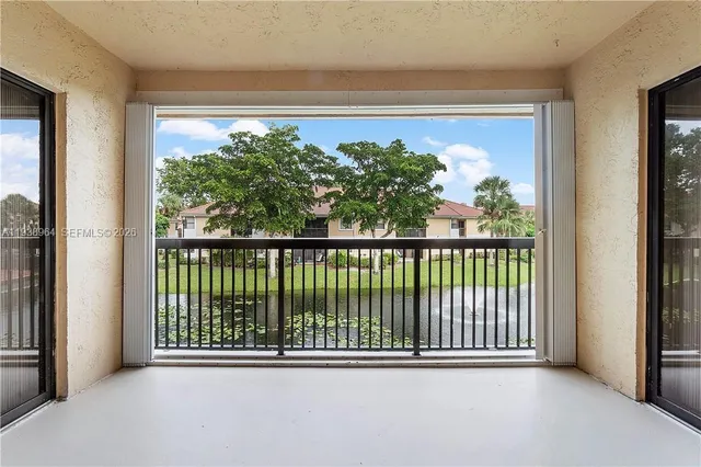 a view of a glass door and a balcony