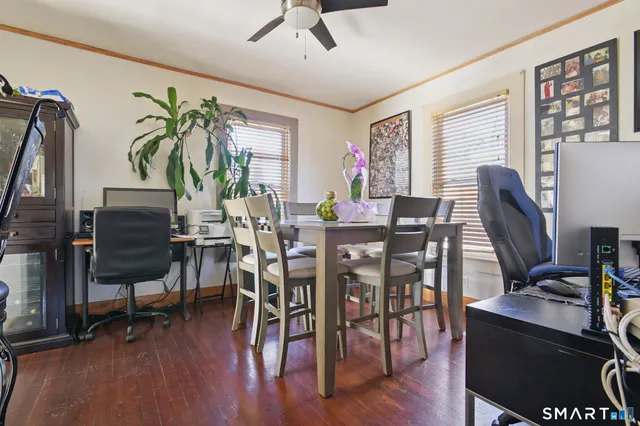 a view of a dining room with furniture window and wooden floor