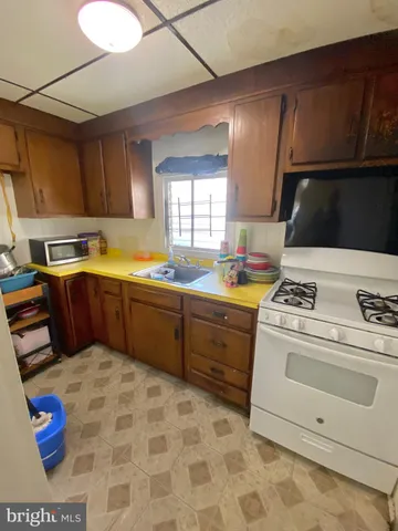 a kitchen that has a sink and a stove