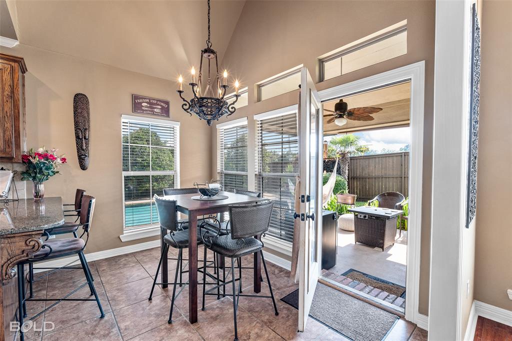 10040 Loveland Court Shreveport, LA 71106 - Photo 13 of 26 a view of a dining room with furniture window and outside view