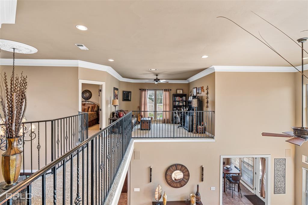 10040 Loveland Court Shreveport, LA 71106 - Photo 21 of 26 a view of a hallway with a dining table chairs