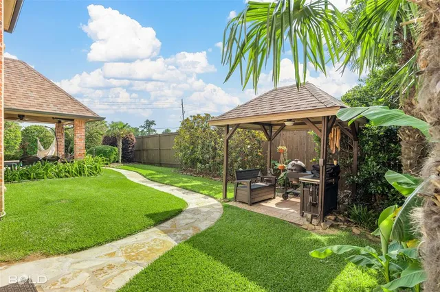 a view of a patio with couches chairs and plants