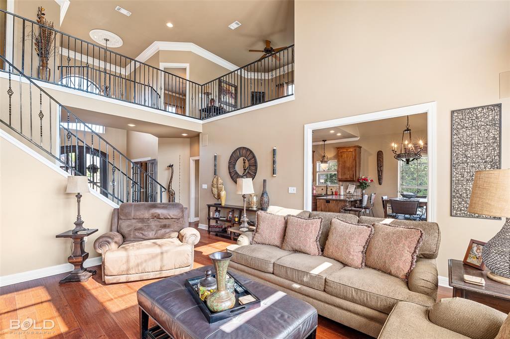 10040 Loveland Court Shreveport, LA 71106 - Photo 9 of 26 a living room with furniture fireplace and a large window