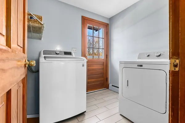 a utility room with dryer and washer