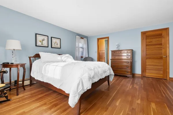 a bedroom with a bed and a table