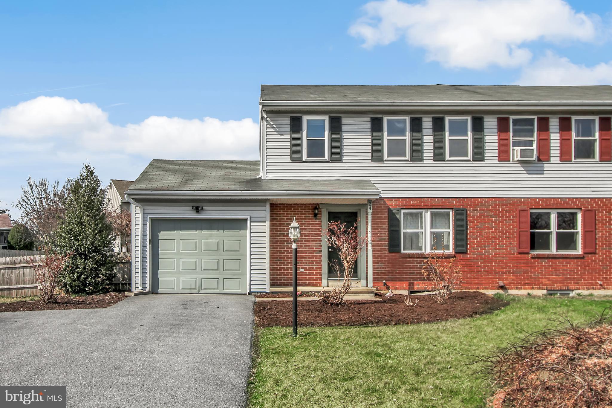24 Winding Way Lititz, PA 17543 - Photo 1 of 27 a front view of a house with a yard and garage